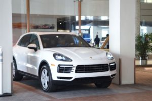 white porsche cayenne at THE COLLECTION showroom